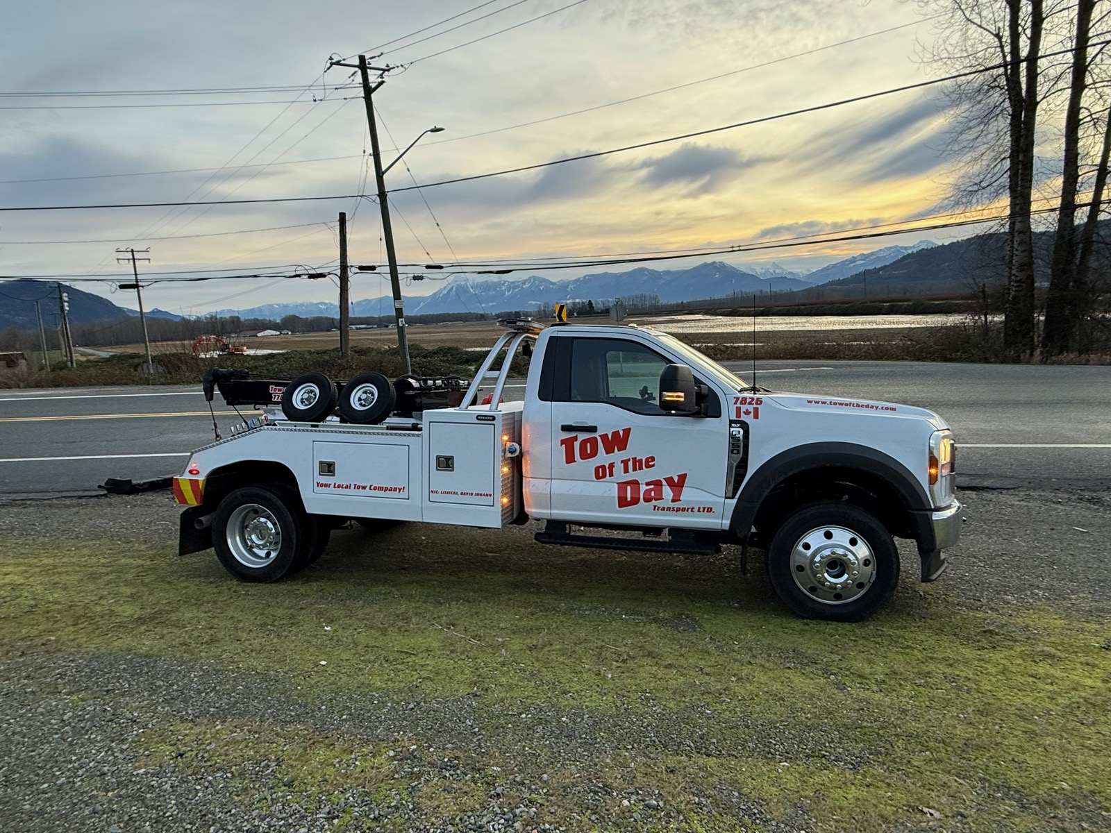 Tow Of The Day tow truck with Fraser Valley mountains at sunset